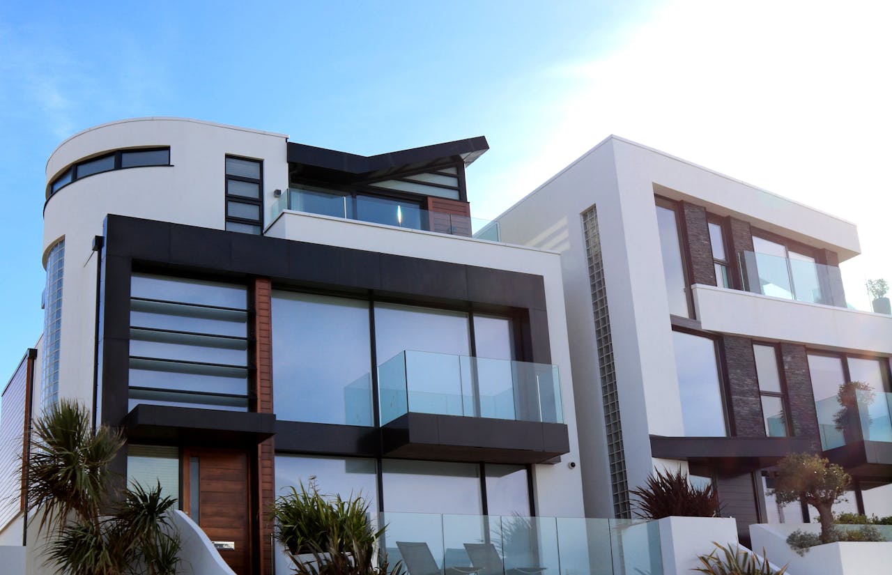 home-hero Contemporary luxury home with glass balconies in Poole, UK, showcasing modern architectural design.